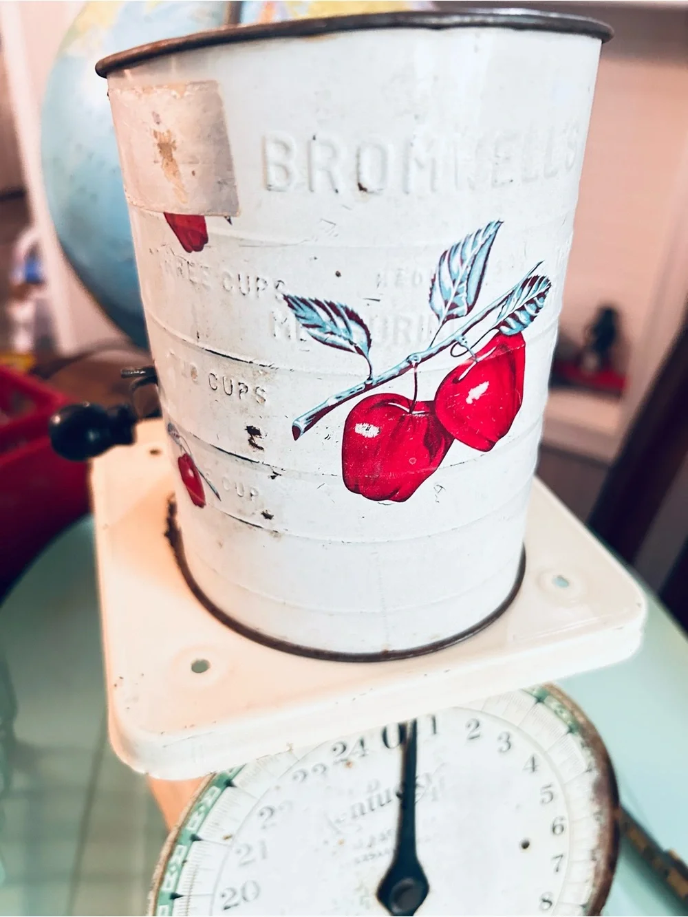 Vintage flour sifter with apple motif